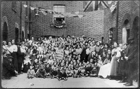 Photo:Group portrait of Lord Portman's tenants of Wilcove Place, Church Street, Lisson Grove. Conveys conditions under which many working-class families lived in London. 1915.